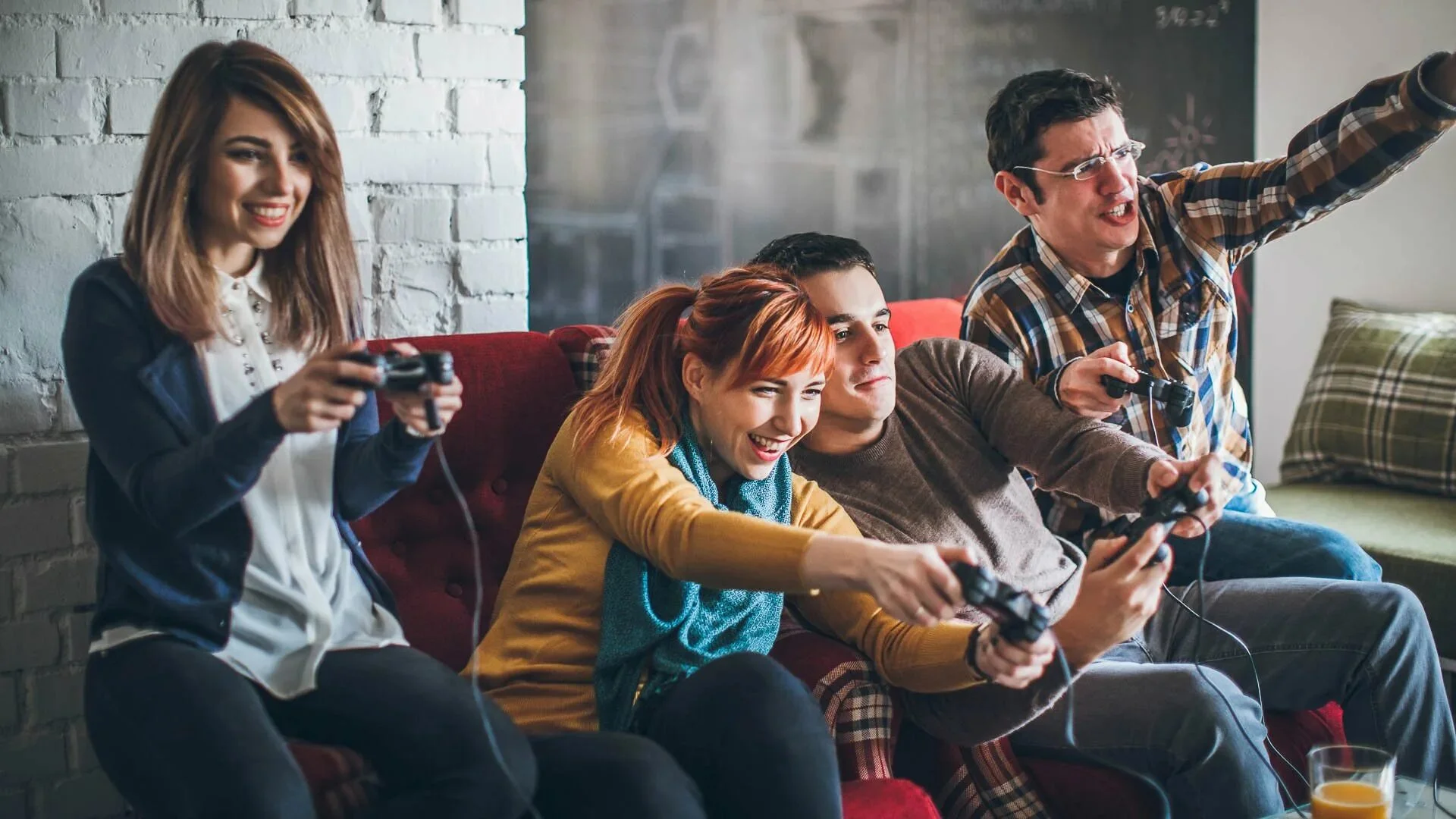 A diverse group of people playing online games together